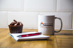 piece of cake marketing mug and notebook.